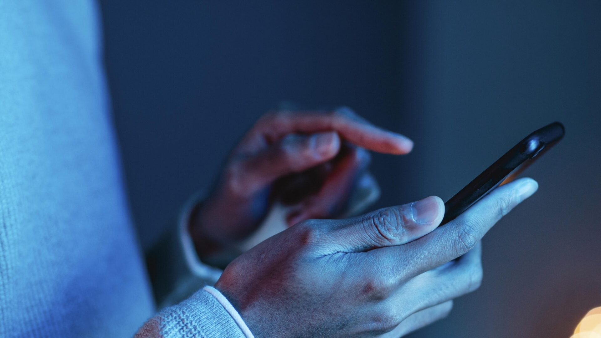 Product Registration 1 side view man using smartphone