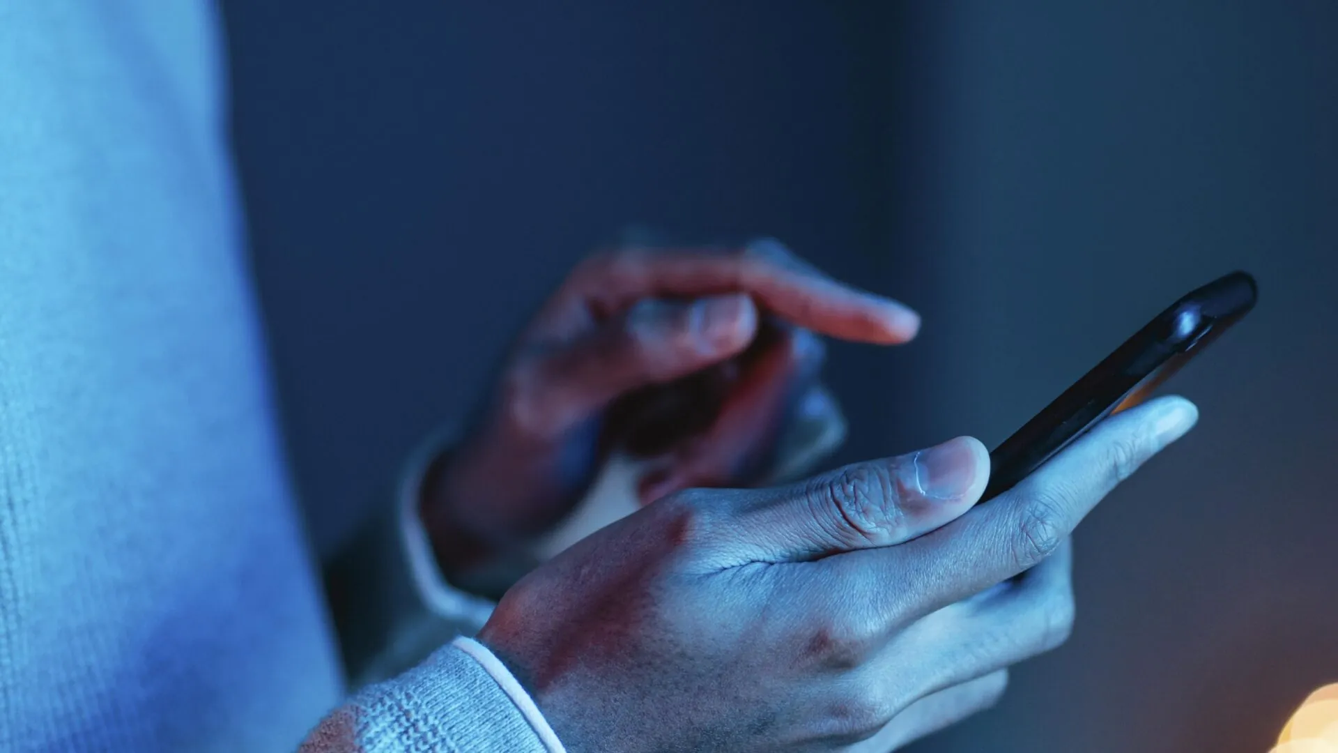 side view man using smartphone