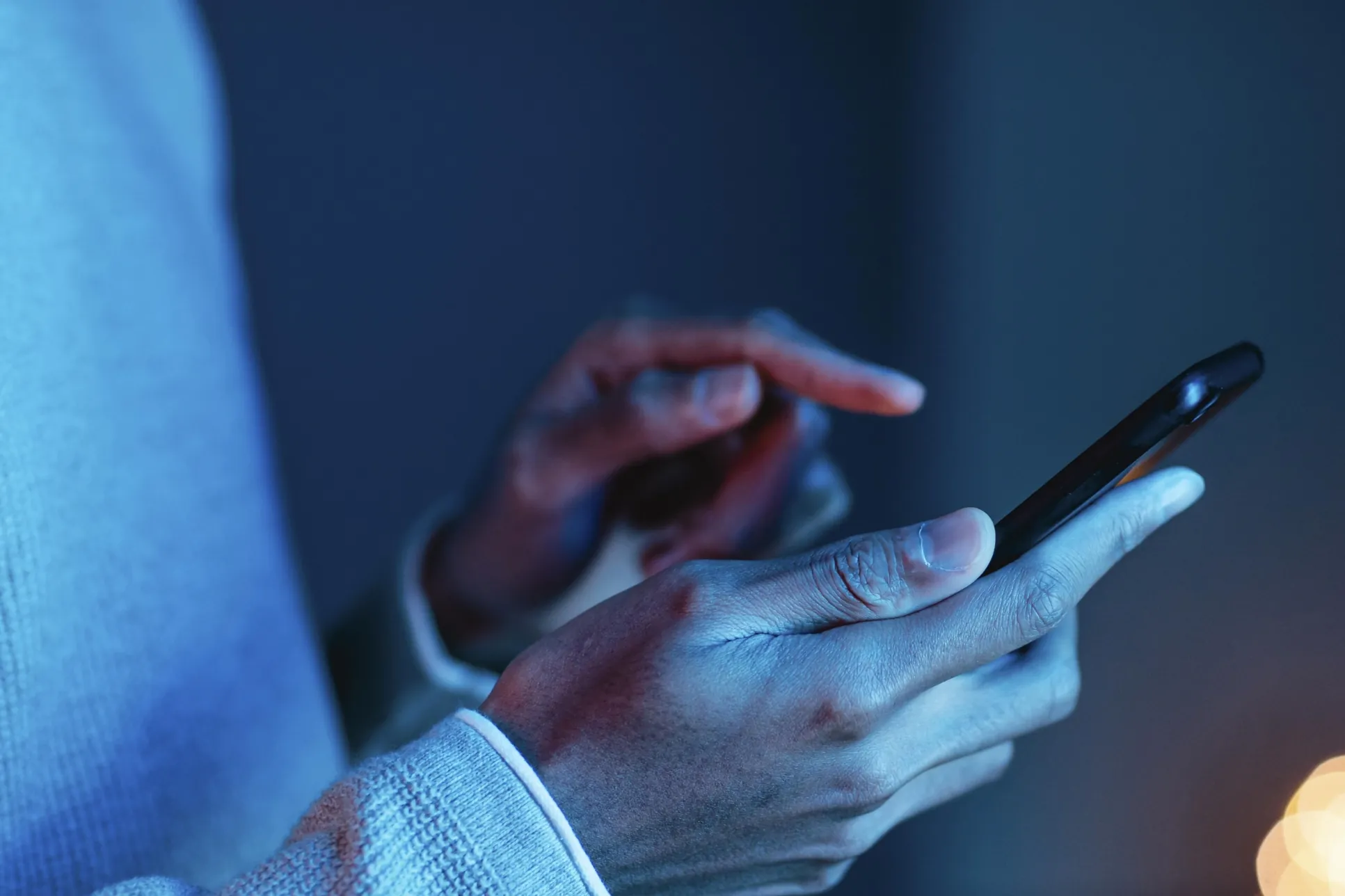 side view man using smartphone